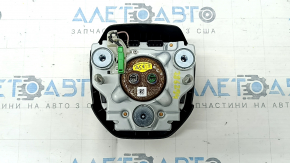 The Honda CRV 20-22 driver's steering wheel airbag is black and has a rusty squib.
