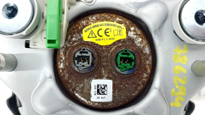 The Honda CRV 20-22 driver's steering wheel airbag is black and has a rusty squib.