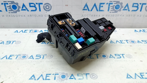 The Honda Insight 19-22 underhood fuse box is large, missing a cover and wiring, and the latch is broken.