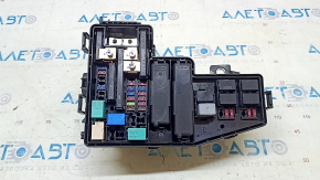 The Honda Insight 19-22 underhood fuse box is large, missing a cover and wiring, and the latch is broken.