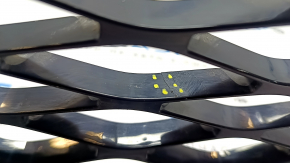 The lower grille of the front bumper of the Volkswagen ID.4 23-25 is black and cracked.