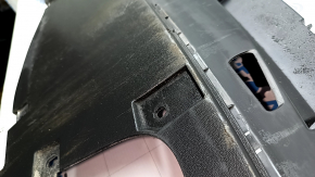 The front bumper center guard for Volkswagen ID.4 23-25 is worn and cracked.