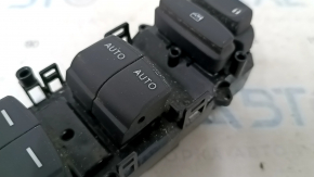 The front left window lift control button on a 19-22 Honda Insight is worn out.