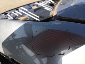 The metal roof of a 19-22 Honda Insight, without a sunroof, is on the body and is dented.
