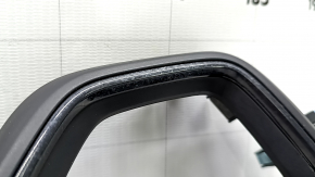 The upper left dashboard cover for a 19-22 Honda Insight is black and water damaged.