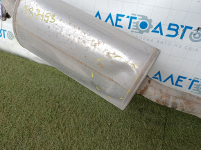 The exhaust pipe with the rear barrel of a Honda CRV 20-22 hybrid is rusty and dented.