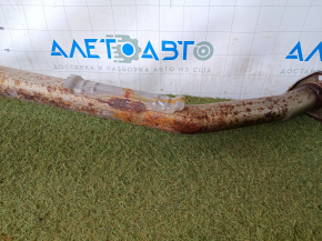 The exhaust pipe with the rear barrel of a Honda CRV 20-22 hybrid is rusty and dented.