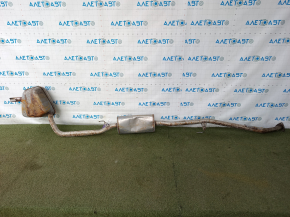 The exhaust pipe with the rear barrel of a Honda CRV 20-22 hybrid is rusty and dented.
