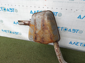 The exhaust pipe with the rear barrel of a Honda CRV 20-22 hybrid is rusty and dented.