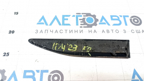 The ID.4 logo emblem on the front right fender of a Volkswagen ID.4 23-25 S is cracked.