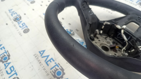 The steering wheel is bare, Volkswagen ID.4 23-25, black leather, heated, with scuffs.