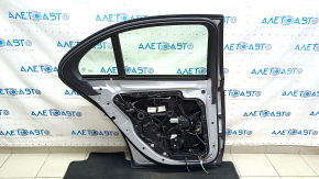 Rear left door assembly for Mercedes W213 E 17-23 silver 988, keyless, with a bumper