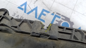 The right front bumper guard for a Volkswagen ID.4 21-22 is worn and the fasteners are torn.