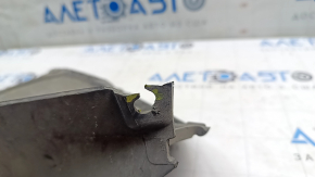 The right front bumper guard for a Volkswagen ID.4 21-22 is worn and the fasteners are torn.