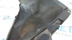 The right front bumper guard for a Volkswagen ID.4 21-22 is worn and the fasteners are torn.