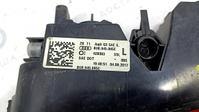 The left rear bumper light of the Audi Q3 8U 15-18 has a broken mount.
