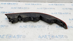 The left rear bumper light of the Audi Q3 8U 15-18 has a broken mount.