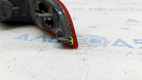 The left rear bumper light of the Audi Q3 8U 15-18 has a broken mount.