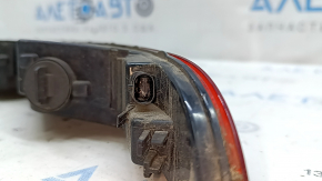 The left rear bumper light of the Audi Q3 8U 15-18 has a broken mount.