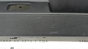 The lower trim of the tailgate of the Audi Q7 4L 10-15 is black, with plugs, without a curtain, worn, scratches
