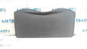 The trunk shelf of the Chevrolet Bolt 17-21 is dark gray and torn.