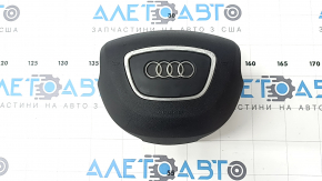 The steering wheel airbag for the driver's side of the Audi Q7 4L 10-15 is black, the chrome is peeling, and there is a scratch.