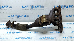 The exhaust manifold with a catalytic converter on a Ford Fusion mk5 17-20 hybrid is rusty and the mesh is torn.