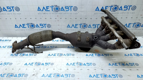 The exhaust manifold with a catalytic converter on a Ford Fusion mk5 17-20 hybrid is rusty and the mesh is torn.