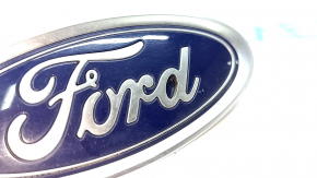 The front bumper emblem badge of the Ford Fusion mk5 13-20 is broken.
