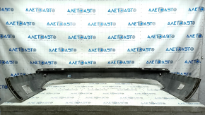 The bare lower rear bumper of a Volvo XC90 16-23, with parking sensors, beige, scratches