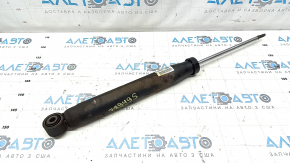 The rear right shock absorber of the Audi Q5 8R 13-17 is rusty and dented.