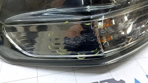 The outer taillight on the left wing of a Lexus RX350 RX400h 06-07 is dark, with spider webs and scratches.
