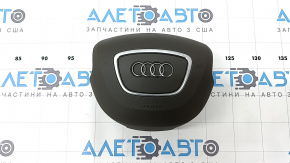 The steering wheel airbag for the driver's side of the Audi Q5 8R 13-17 is brown and the chrome is peeling.