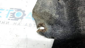 The rear left fender liner of a Toyota Camry v40 has a torn mount.