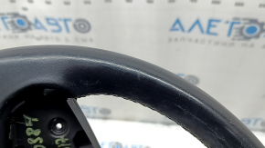 The steering wheel is bare, BMW 5 G30 17-22, black leather, Sport, heated, with a signal plate, under the paddle shifters, peeling, needs cleaning, scratches