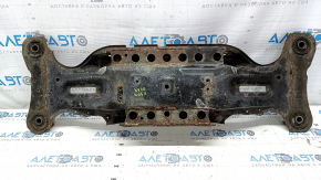 The rear subframe of a Toyota Camry V40 is rusty.
