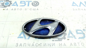 The Hyundai Sonata 11-15 hybrid trunk lid emblem has a dented backing.