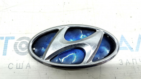 The Hyundai Sonata 11-15 hybrid trunk lid emblem has a dented backing.