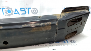 The front bumper reinforcement for a Toyota Camry V40 is rusty.