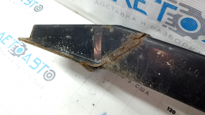 The front bumper reinforcement for a Toyota Camry V40 is rusty.