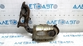 The rear exhaust manifold with a catalytic converter for a Lexus RX400h 06-08 is rusty and missing one stud.