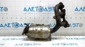 The rear exhaust manifold with a catalytic converter for a Lexus RX400h 06-08 is rusty and missing one stud.