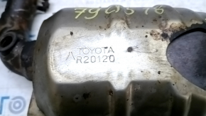 The rear exhaust manifold with a catalytic converter for a Lexus RX400h 06-08 is rusty and missing one stud.