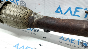 The Toyota Camry V40 hybrid exhaust pipe and catalytic converter are rusty.