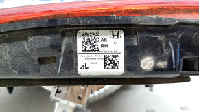 The right interior tailgate light of a Honda Accord 18-20 hybrid has a broken window.