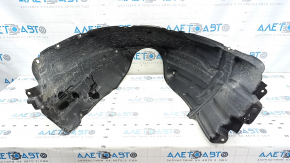 The front right fender liner of a Toyota Camry v40 has a torn mount.