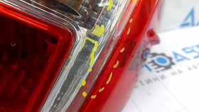 The outer right fender light of a Toyota Camry v50 12-14 USA has a cracked glass.