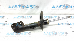 The front left shock absorber of a Toyota Camry V40 hybrid is rusty.