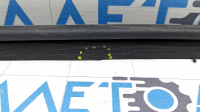 The trunk lid seal on a Toyota Camry V50 12-14 USA is torn.