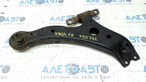 The lower front right control arm of a Toyota Camry v40 is rusty, with microcracks.